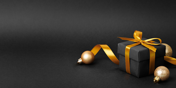 Give gift, holidays are coming concept. Christmas minimal composition. Beige gift box with golden ribbon bow top view, flat lay 3d rendering