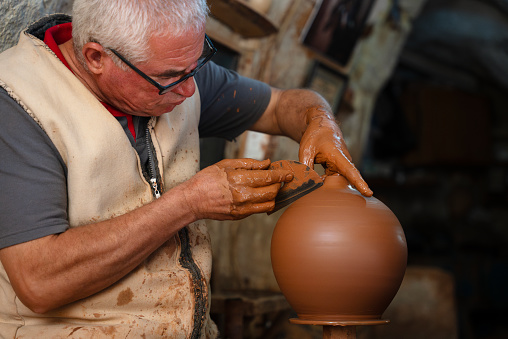 ceramic artisan is crafting a handmade vase