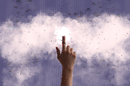 Woman touching cloud