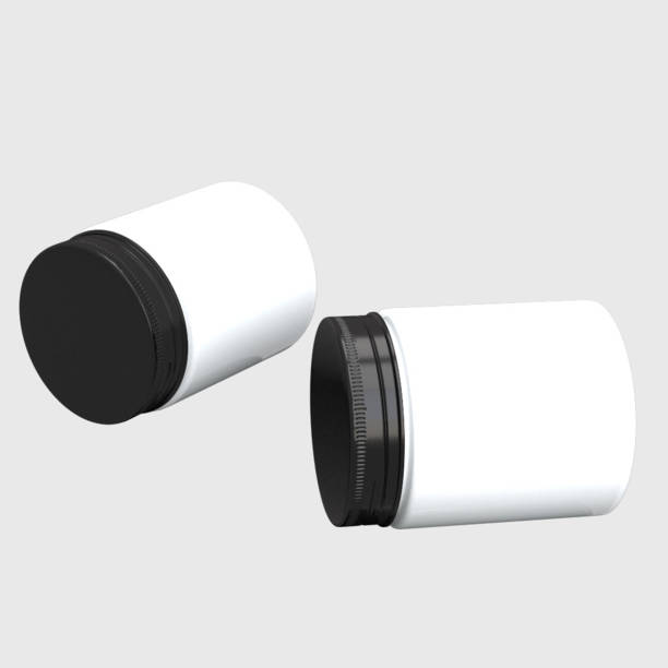 istock Two lying down jars with dark aluminium caps. Mockup white labels. 1720302275