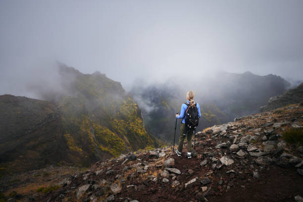 Woman hikes on PR1 Pico do Arieiro - Pico Ruivo trail Madeira Portugal