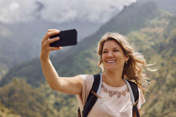 istock Happy hiker taking a selfie on a mountain. 1720324163