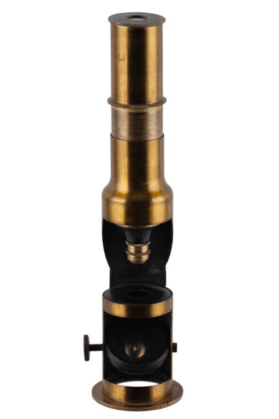 istock Vintage brass microscope. Small hand microscope from the 20th century. 1720347280