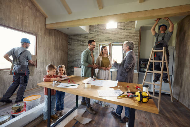 istock Happy parents talking to an architect during home renovation process. 1720361450