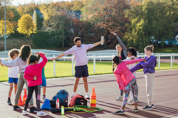 istock Kids Stretching on the Track 1720366307