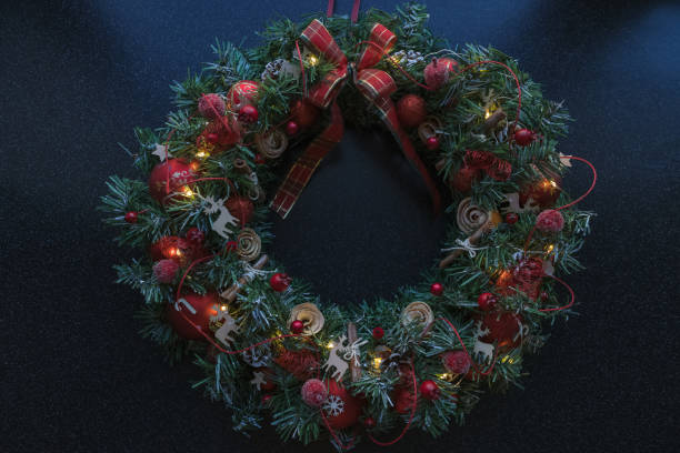 istock classic christmas wreath with red decor and illumination 1720376919