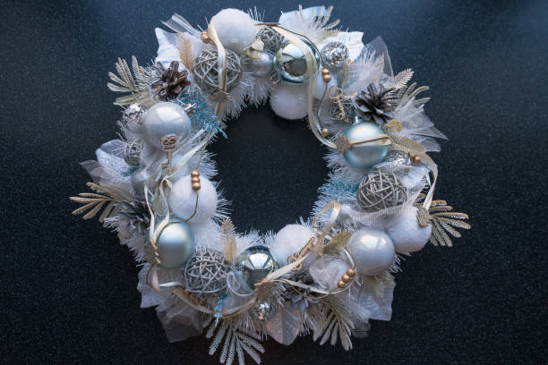 top view of white christmas wreath with golden blue and grey details