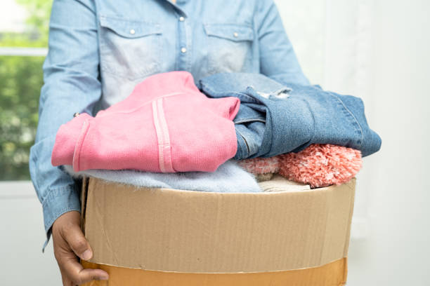 istock Donation box with used clothes at home to support help for poor people in the world. 1720383586