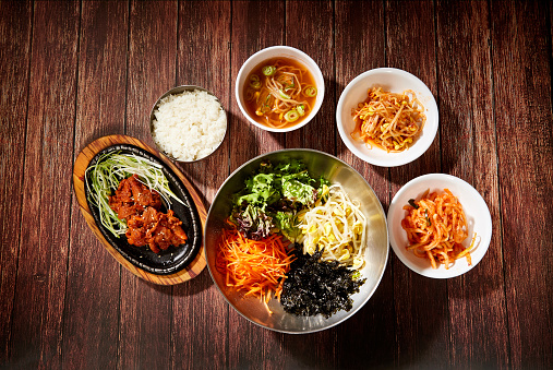 Korean food mixed with various vegetables, and pork with red pepper paste sauce
