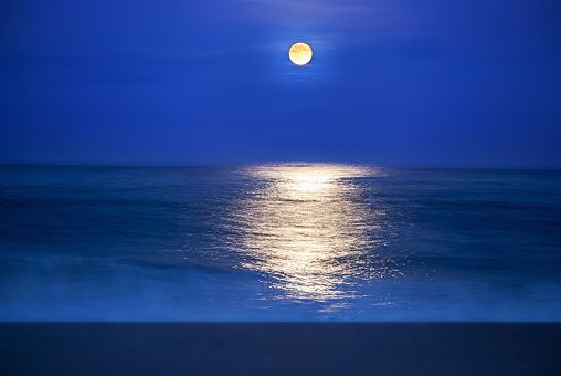 A full moon reflects on the Atlantic Ocean in Sandy Hook, along the Jersey shore.