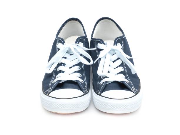 istock A pair of navy blue sneakers isolated on a white background. 1720425242