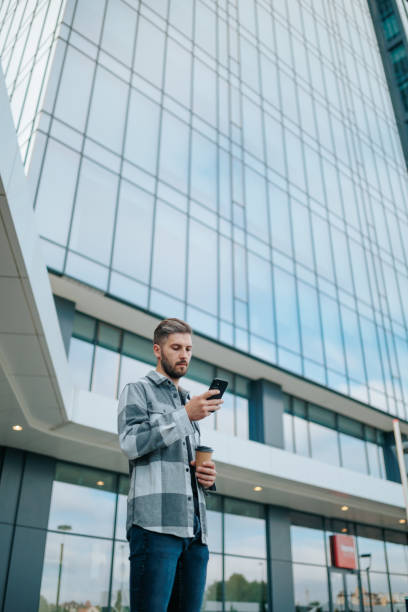 istock vertical shot Mobile Marvels in the Metropolis Portrait of a Stylish Guy copy space 1720438920