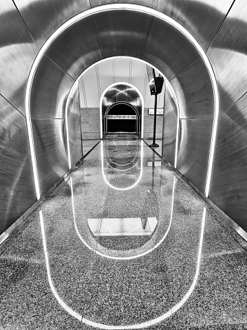 Interior elements of a modern metro station in Moscow. Black and white photo of the arch illuminating the Rizhskaya metro station in Moscow.