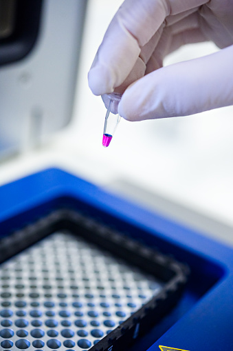 Close-Up Preparing tests liquid laboratory shaker