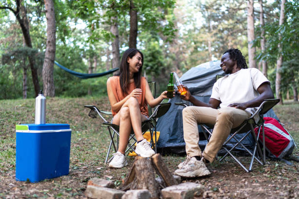 istock Friends camping, drinking beer and having fun 1720453083