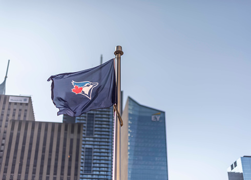 Toronto, Ontario, Canada- October 3rd, 2023: A Toronto Blue Jays flag at Toronto's City Hall's  Nathan Phillips Square.