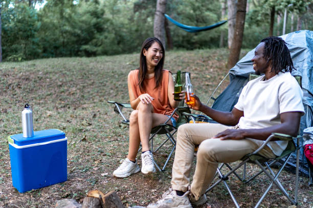 istock Friends camping, drinking beer and having fun 1720456402