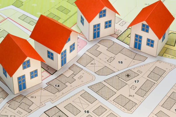 istock New home and free vacant land for building activity - Construction industry and building permit concept with a residential area, cadastral map, General Urban Planning and zoning regulations 1720456411