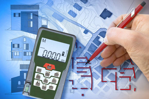 istock Architect drawing a new residential building over an imaginary cadastral map of territory 1720458587