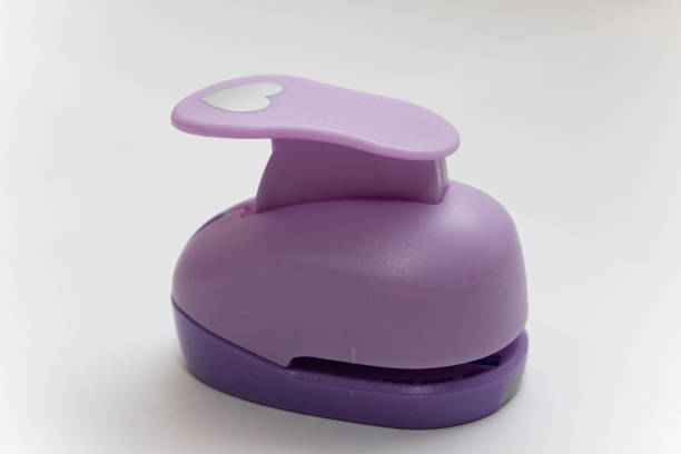 istock A purple hole puncher with a heart sticker 1720484409