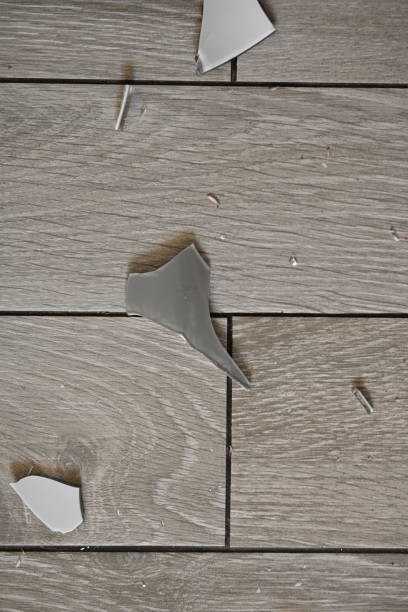 istock pieces of broken glass on the tile 1720498452