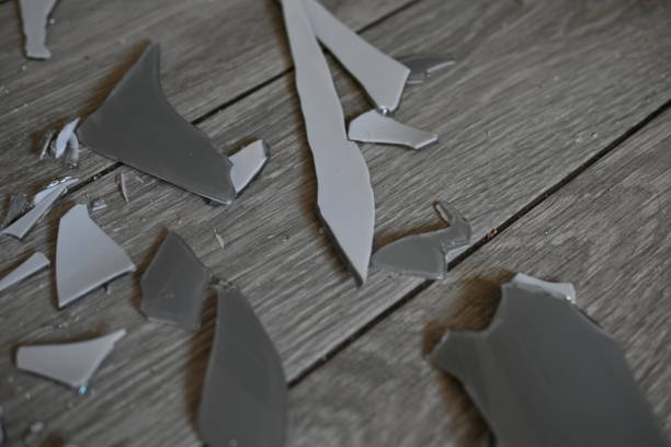 istock glass shards on the floor as a backdrop, broken dishes grey as a backdrop. 1720499036