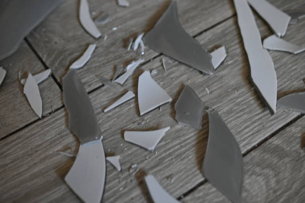 istock glass shards on the floor as a backdrop, broken dishes grey as a backdrop. 1720499563