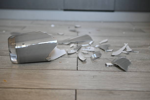 istock broken glassware on the floor, the consequences of a quarrel smashed glassware on the gray floor 1720502179