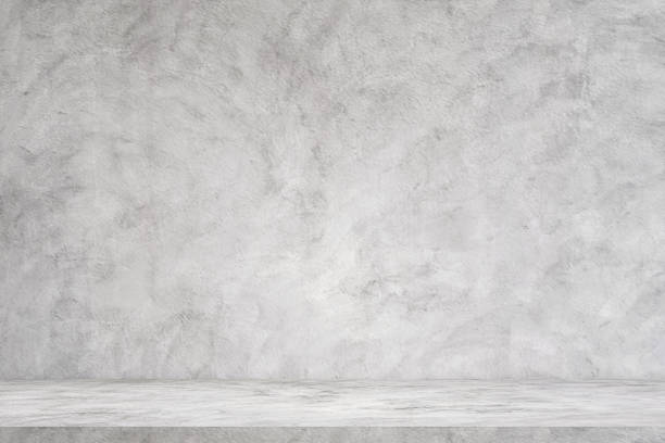 istock background and concrete backdrop and cement shelf showing products in black and gray , empty studio interior and with empty messages background. 1720512438