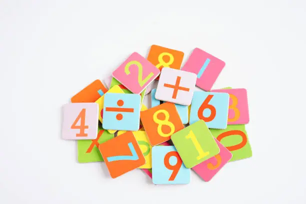 Photo of Number wood block cubes for learning Mathematic, education math concept.