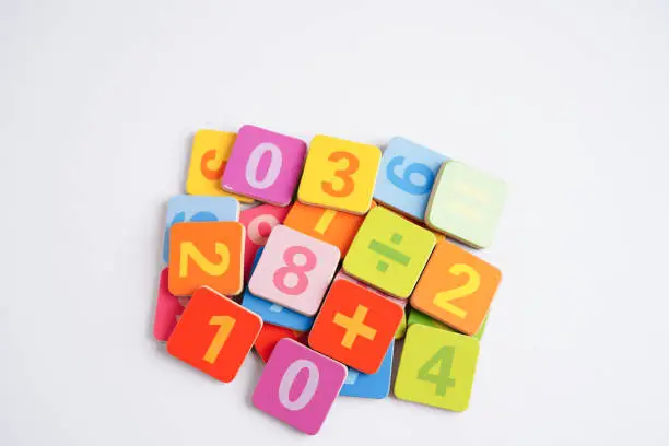 Photo of Number wood block cubes for learning Mathematic, education math concept.