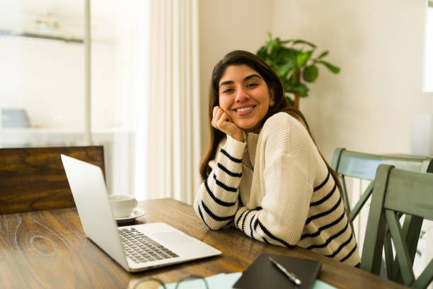 istock Busy beautiful woman happy about working from home 1720551054