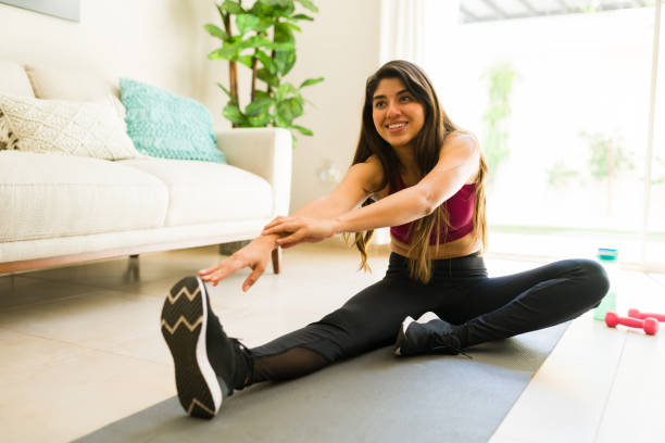 istock Happy active woman preparing for a home workout 1720581947