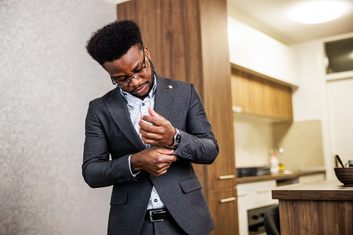 Elegant man getting dressed