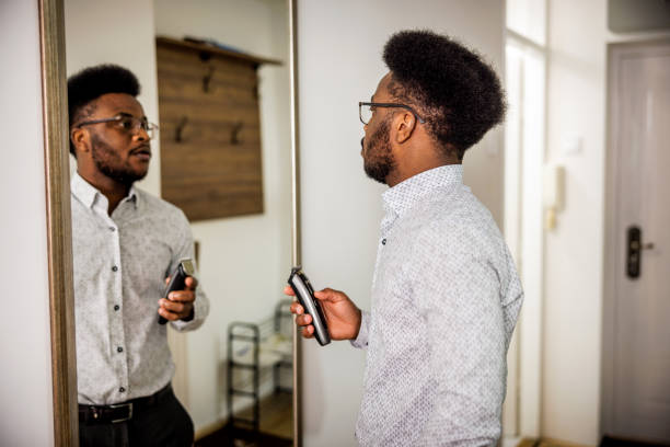 istock Man cutting beard in the morning 1720649099