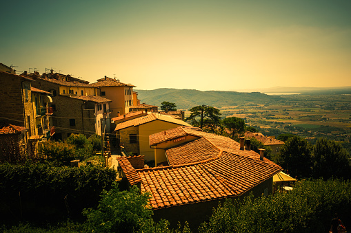 View east over the orange roof tops of Cortona, Tuscany, Italy.