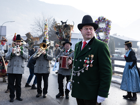 Vilalba, Lugo, Spain- December 21, 2021: Folk musicians wearing traditional clothing, playing bagpipes in the street , Vilalba, Lugo province, Galicia, Spain.