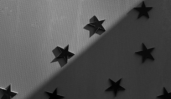 black and white small metal stars on a gray background