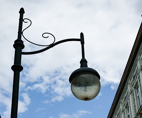 Retro lantern on the background of the blue sky. vintage lantern. A street lantern.