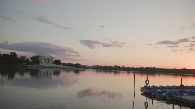 Thomas Jefferson monument and building at pond during evening