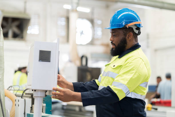 istock Male engineer worker control CNC machine at the industry factory. Male technician inspecting quality of machine in the factory 1720738418