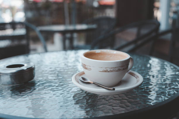 istock Empty coffee cup after drink with ashtray on outdoor table 1720747932