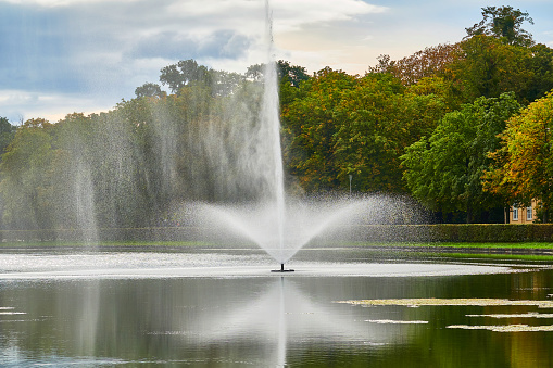 Rose Park with Regency Building in Bad Kissingen. The Regentenbau is a landmark of the spa town of Bad Kissingen. Built according to the plans of the Munich architect Max Littmann in the architectural style of neoclassicism, the event building was inaugurated in 1913. The Rose Garden is a public park and is located in the center of Bad Kissingen along the Franconian Saale. The Rose Garden was inaugurated in 1913, the same year as the Regentenbau. On June 26, 2016, the Rose Garden was reopened after seven months of general renovation with new extensive technology for the fountain. The Balthasar Neumann Promenade can be seen in the background.