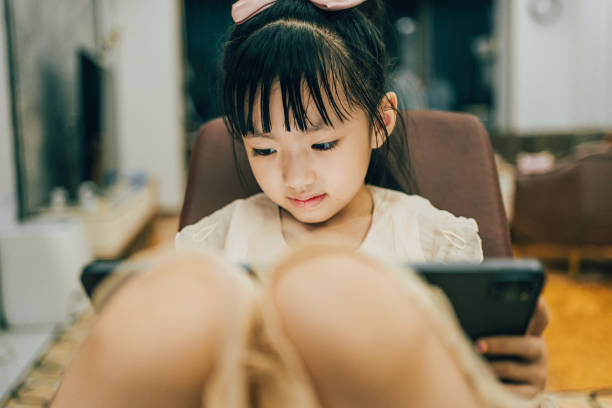 istock An Asian girl drawing on a tablet 1720770187
