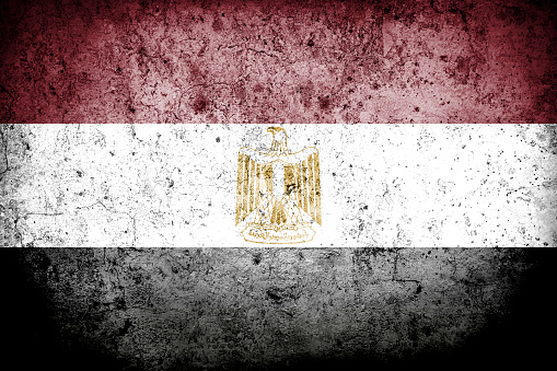 Flag of Egypt with faded grunge effect, perfect for backgrounds and design.