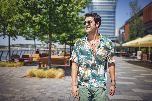 Portrait of a handsome modern man outdoors in city.