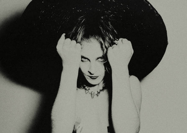 Portrait of young mysterious woman with hat. Neo-Pictoralism.