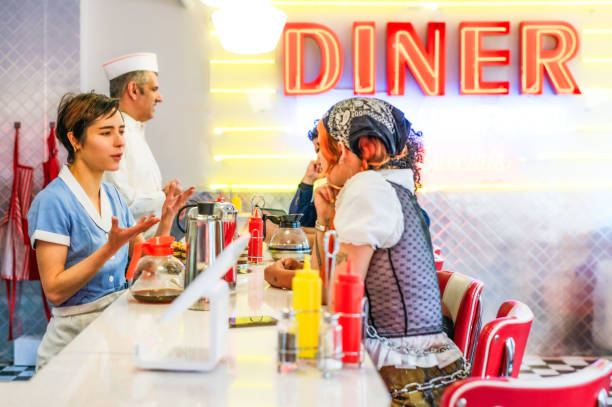 istock Customers and staff in a modern diner 1720797986