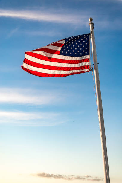 istock Waving American flag on a pole in America 1720809849