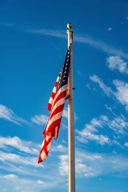 istock Waving American flag on a pole in America 1720810289